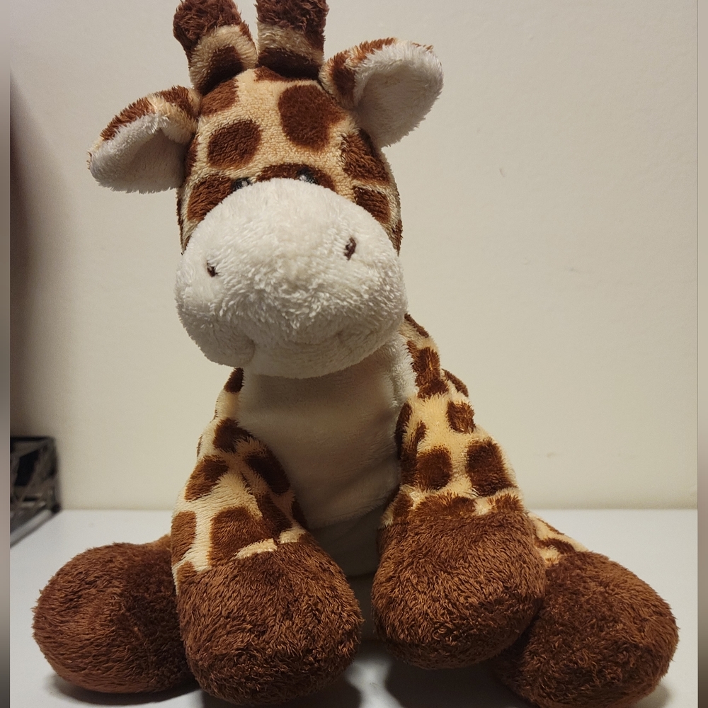 TY Tip Top Giraffe.Brown spotted,11" tall, 11" width  no rips or stains. 2006
